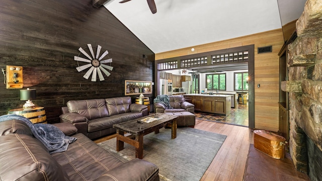 1115 Old Cartertown Rd, Road, Gatlinburg, TN 37738 - living area with high vaulted ceiling, wood walls, a ceiling fan, and hardwood / wood-style floors