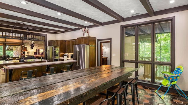 1115 Old Cartertown Rd, Road, Gatlinburg, TN 37738 - kitchen with high end refrigerator, beamed ceiling, dark brown cabinets, dark tile patterned flooring, and recessed lighting