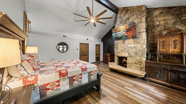 1115 Old Cartertown Rd, Road, Gatlinburg, TN 37738 - bedroom featuring wood finished floors, beamed ceiling, high vaulted ceiling, a fireplace, and a ceiling fan