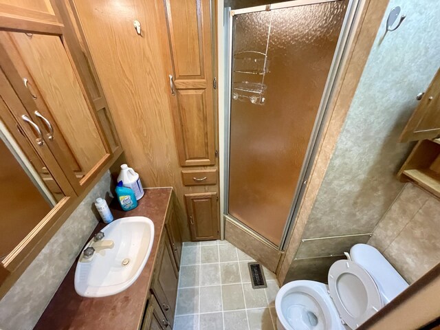 4124 Big Creek Rd, Hartford, TN 37753 - full bathroom featuring vanity, tile patterned flooring, toilet, and a stall shower