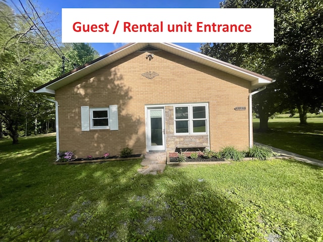 4124 Big Creek Rd, Hartford, TN 37753 - view of front of property with a front yard and brick siding