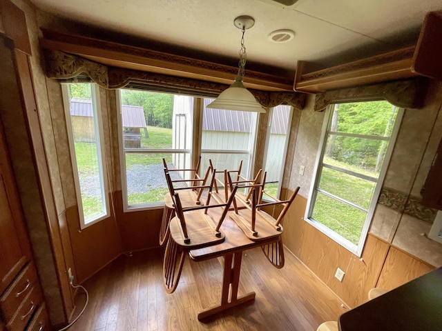 4124 Big Creek Rd, Hartford, TN 37753 - dining space with healthy amount of natural light, hardwood / wood-style flooring, and wooden walls