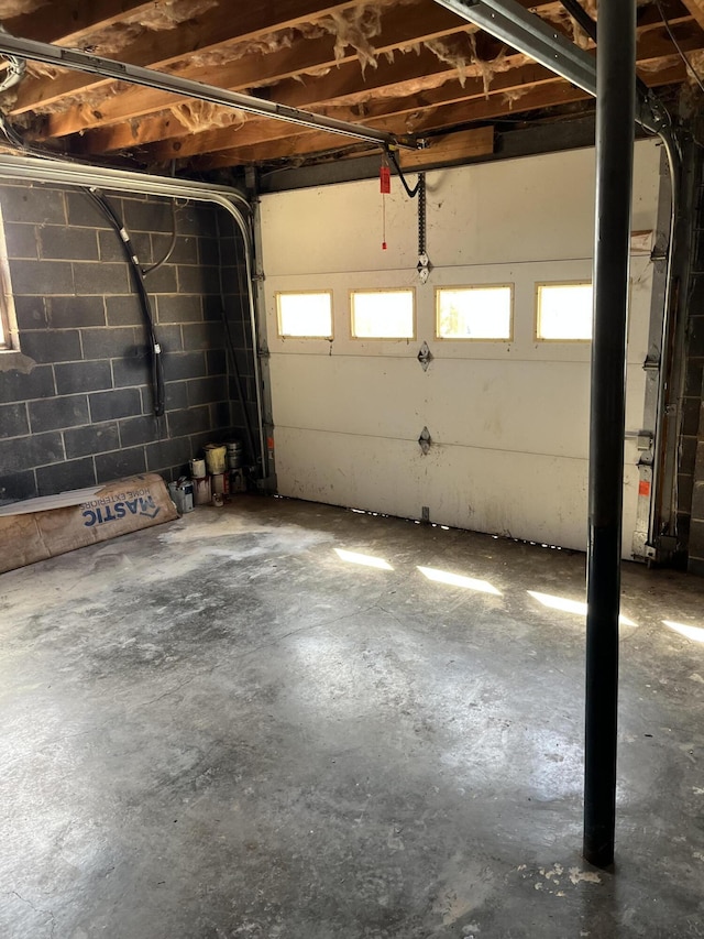 garage with concrete block wall