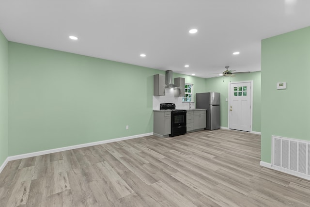 812 Donna St, Morristown, TN 37814 - kitchen featuring freestanding refrigerator, wall chimney exhaust hood, electric range, gray cabinets, and visible vents