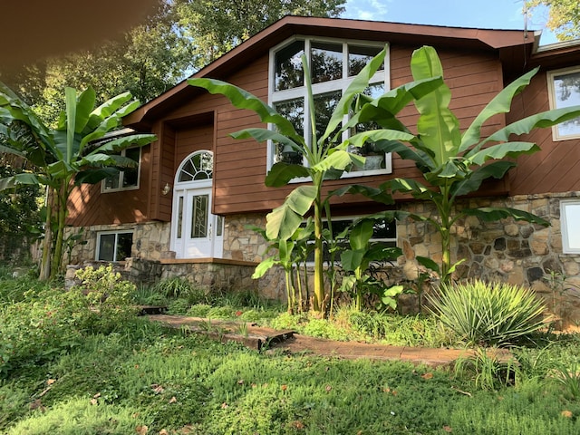 exterior space with stone siding