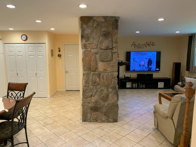 living room featuring light tile patterned flooring and recessed lighting