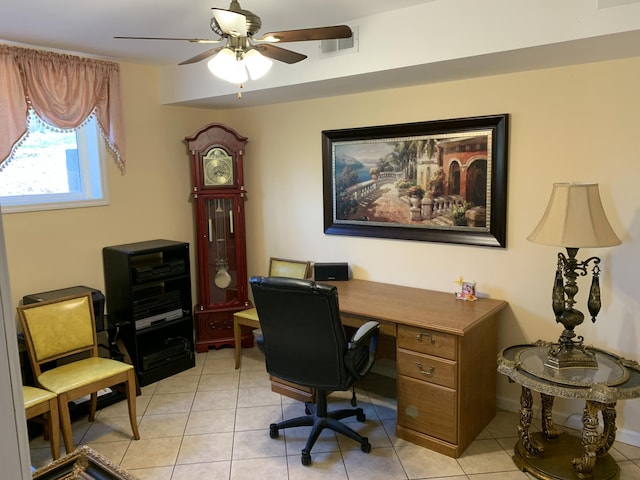 home office featuring light tile patterned floors, visible vents, and a ceiling fan