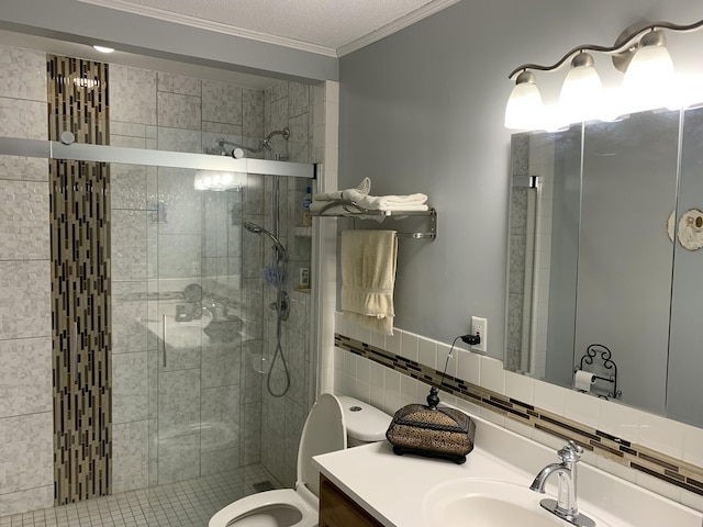 bathroom with ornamental molding, a stall shower, vanity, and toilet