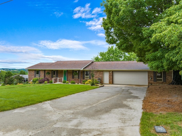 1327 Clinch View Cir, Jefferson City, TN 37760 - single story home with concrete driveway, an attached garage, a front lawn, brick siding, and a porch