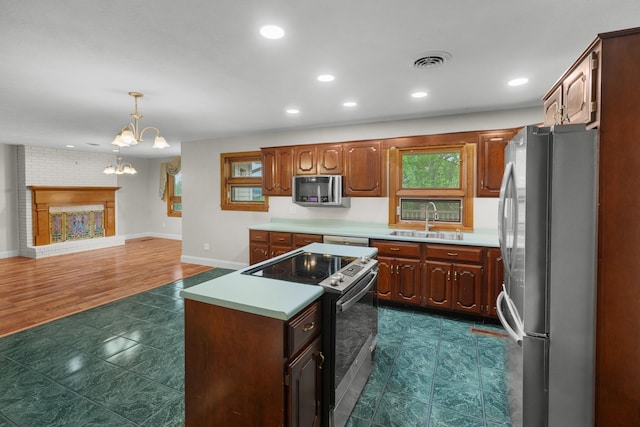 1327 Clinch View Cir, Jefferson City, TN 37760 - kitchen featuring appliances with stainless steel finishes, a sink, light countertops, a center island, and a chandelier