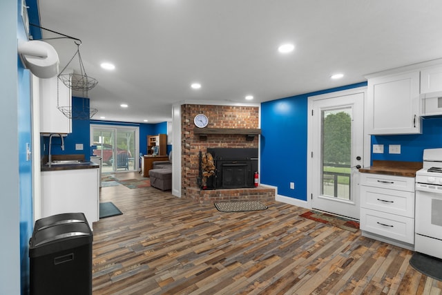 1327 Clinch View Cir, Jefferson City, TN 37760 - kitchen featuring white electric stove, dark countertops, a sink, open floor plan, and recessed lighting
