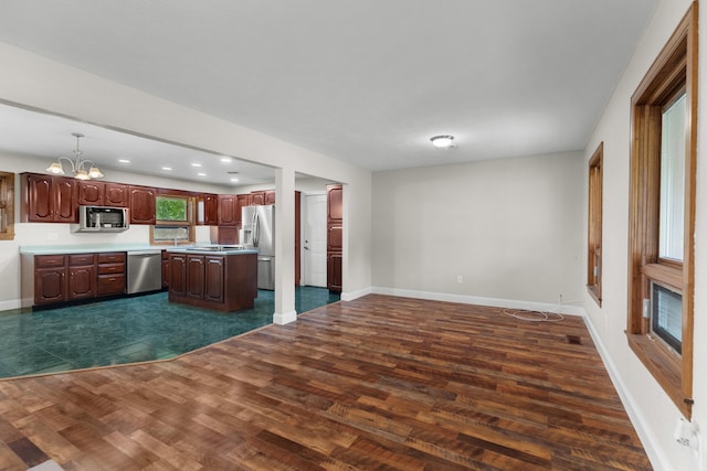 1327 Clinch View Cir, Jefferson City, TN 37760 - kitchen featuring appliances with stainless steel finishes, a chandelier, light countertops, dark wood finished floors, and open floor plan