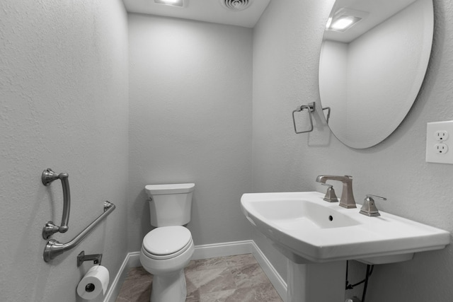 1327 Clinch View Cir, Jefferson City, TN 37760 - half bathroom with toilet, baseboards, and a sink