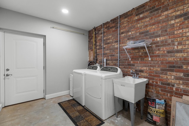 1327 Clinch View Cir, Jefferson City, TN 37760 - laundry room featuring washing machine and dryer and brick wall