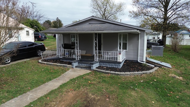 bungalow-style house with a front lawn and a porch