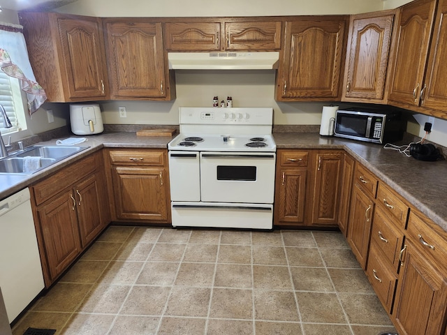 kitchen featuring sink and white appliances