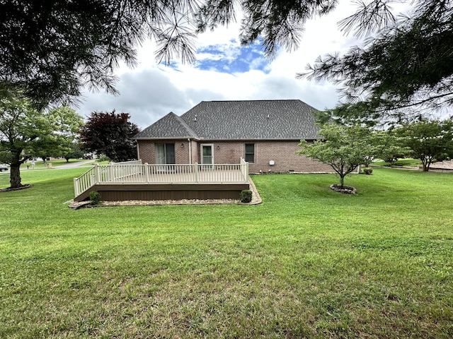 4815 Stapleton Rd, Morristown, TN 37813 - rear view of house with a deck, brick siding, and a lawn