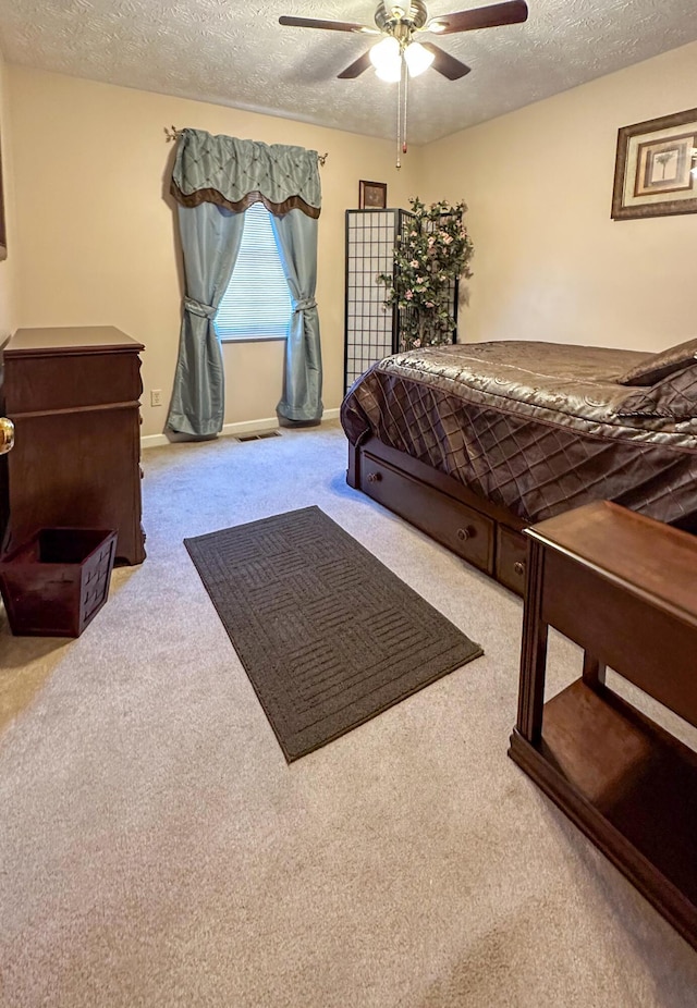 4815 Stapleton Rd, Morristown, TN 37813 - carpeted bedroom with a textured ceiling and ceiling fan