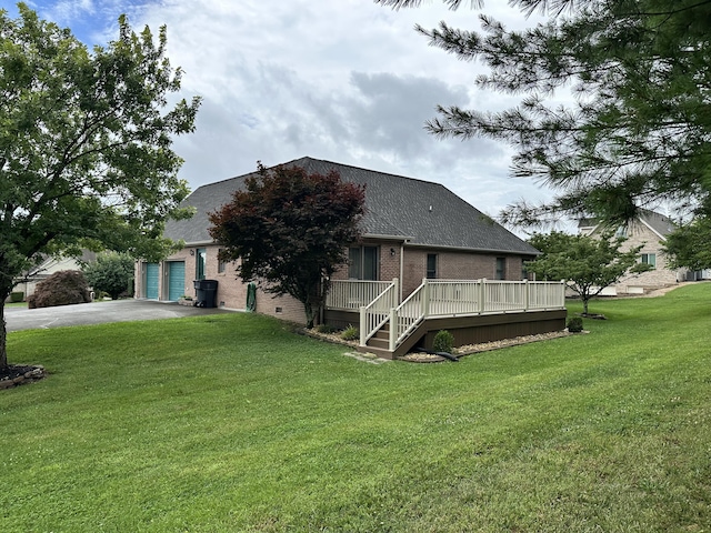 4815 Stapleton Rd, Morristown, TN 37813 - view of front of property with driveway, brick siding, a deck, a front lawn, and an attached garage
