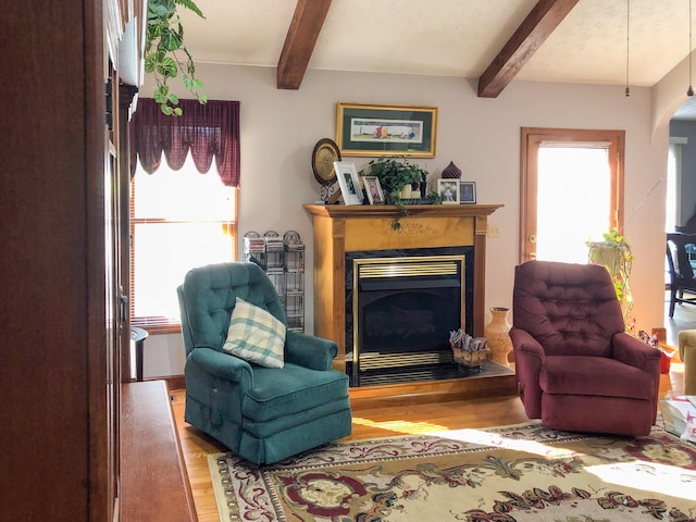 4815 Stapleton Rd, Morristown, TN 37813 - living area featuring wood finished floors, beam ceiling, and a fireplace