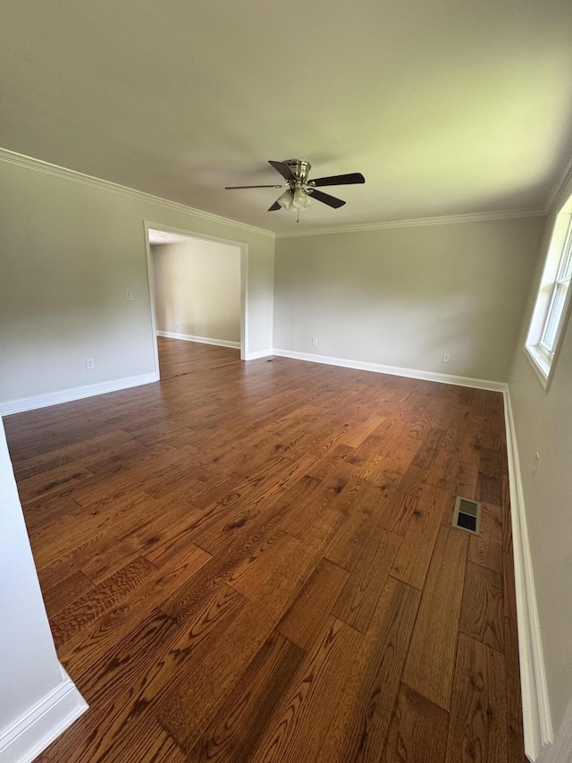 2276 White Oak Grove Rd, Morristown, TN 37813 - spare room featuring a ceiling fan, ornamental molding, dark wood-style flooring, and baseboards
