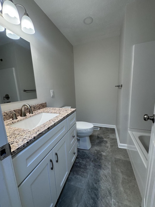 2276 White Oak Grove Rd, Morristown, TN 37813 - full bathroom with toilet, vanity, a textured ceiling, and baseboards