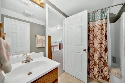 bathroom featuring vanity and a shower with curtain