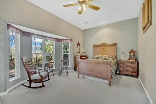 bedroom featuring carpet and baseboards