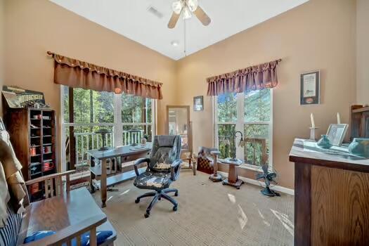 office with a ceiling fan, carpet flooring, and baseboards