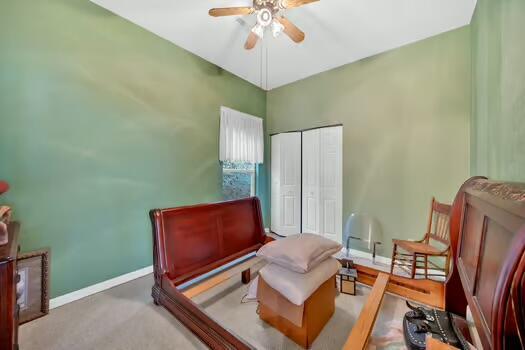 bedroom with a closet and baseboards