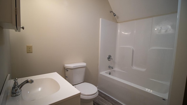 full bathroom featuring hardwood / wood-style flooring, vanity, bathtub / shower combination, and toilet