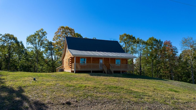 log-style house with a front yard