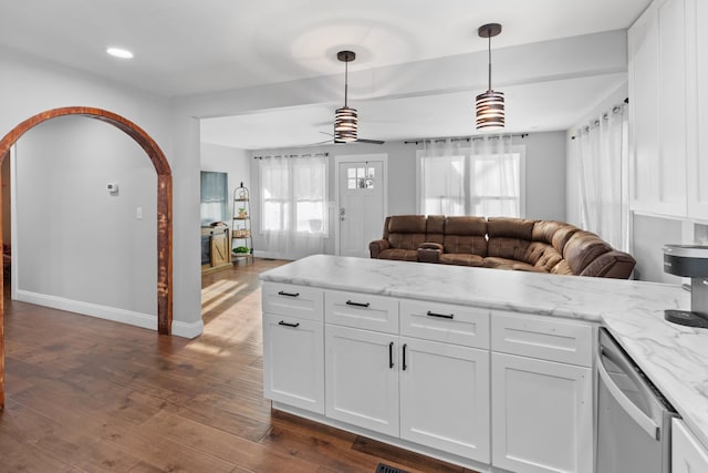 kitchen with pendant lighting, white cabinets, ceiling fan, light stone countertops, and dark hardwood / wood-style flooring