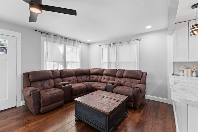 living room with ceiling fan and dark hardwood / wood-style floors