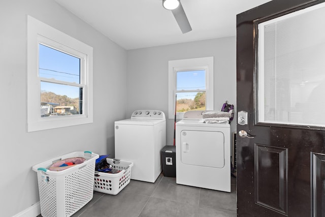 laundry room with tile patterned floors, ceiling fan, and washing machine and clothes dryer