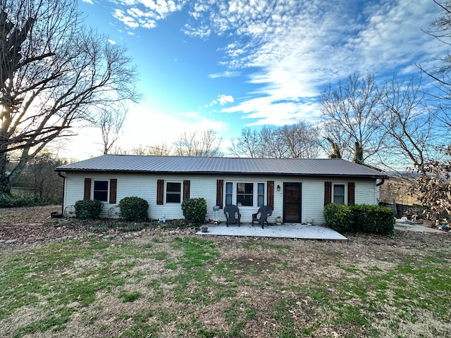 single story home featuring a patio area