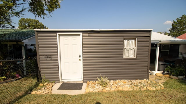 view of shed with fence