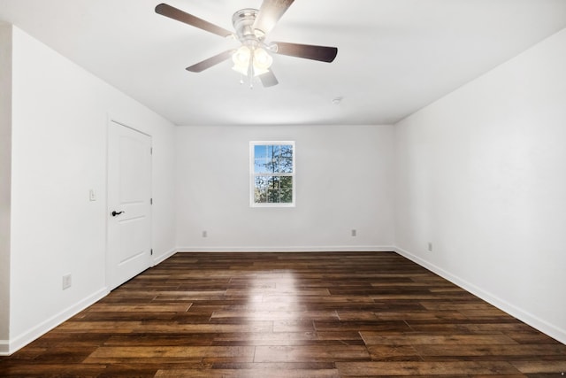 spare room with ceiling fan and dark wood-type flooring