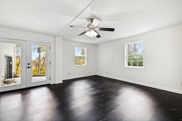 unfurnished room featuring ceiling fan and french doors