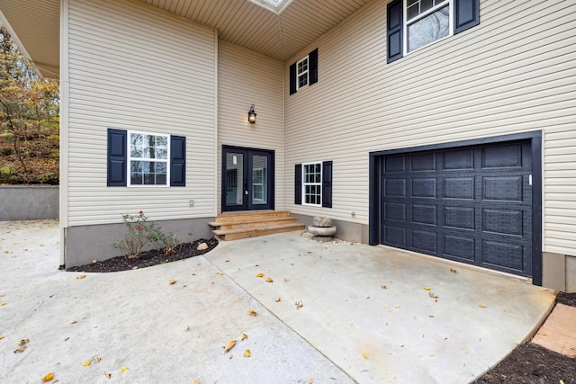 property entrance featuring french doors and a garage