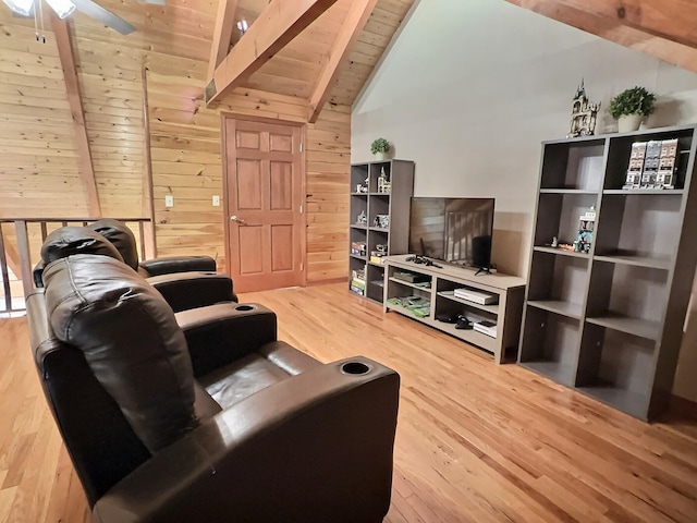 living room featuring vaulted ceiling with beams, hardwood / wood-style flooring, wooden walls, and wood ceiling