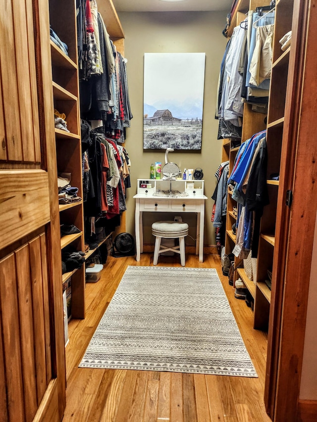 spacious closet with light hardwood / wood-style floors