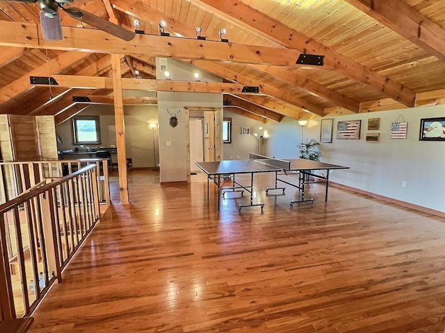 recreation room with wood-type flooring, vaulted ceiling with beams, ceiling fan, and wooden ceiling