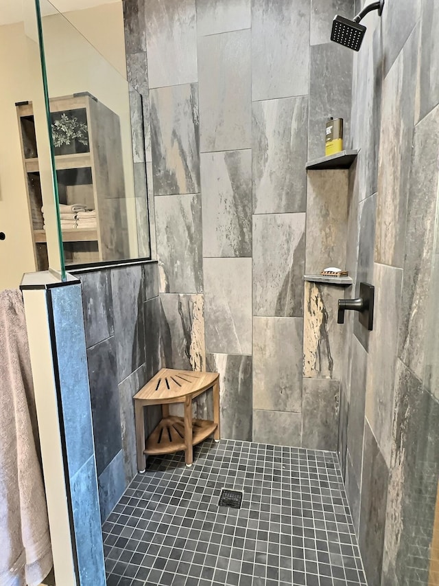 bathroom with a tile shower