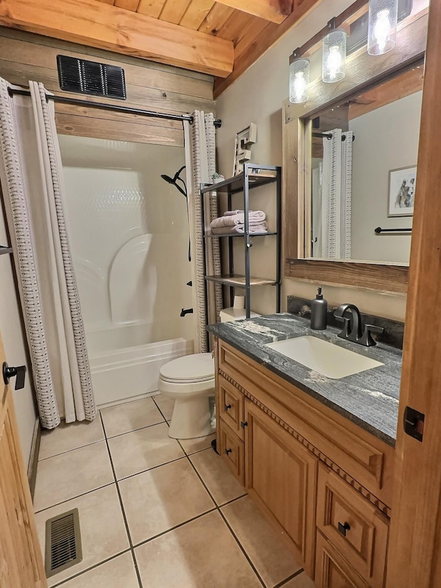 full bathroom featuring beam ceiling, tile patterned flooring, toilet, shower / bath combo with shower curtain, and wood ceiling