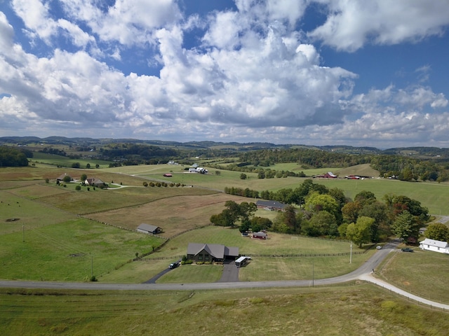 birds eye view of property with a rural view