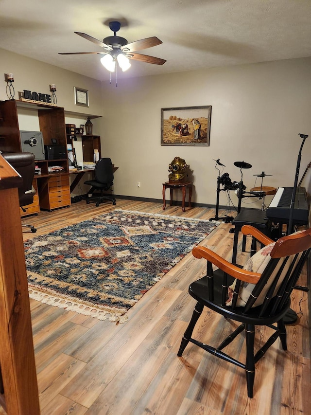 home office with ceiling fan and wood-type flooring