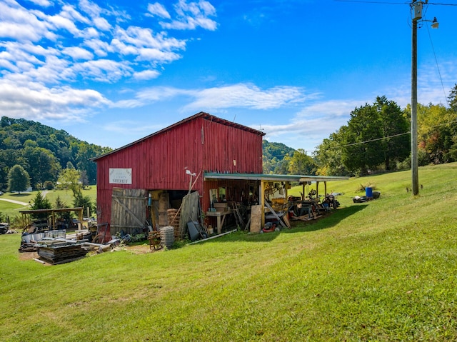 view of outbuilding with a yard