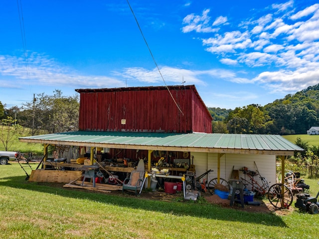 view of outbuilding featuring a yard