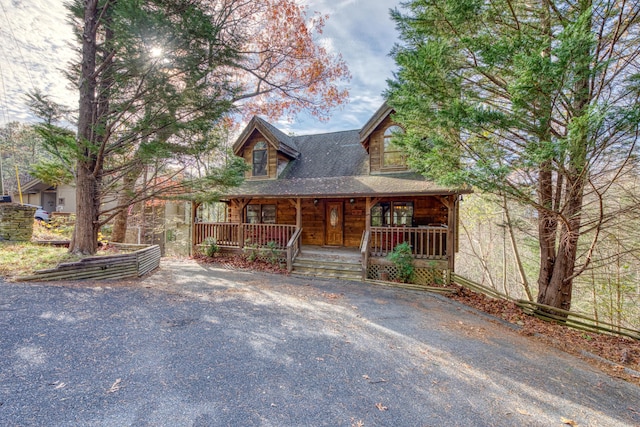 log-style house with a porch